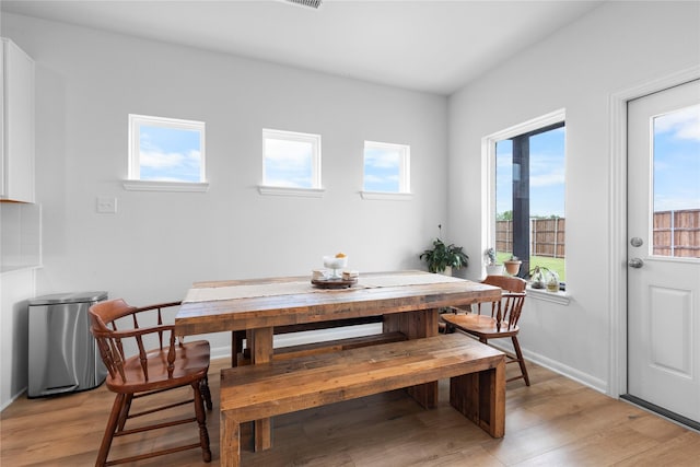 2939 Peony Dr, Sherman, TX 75092 - dining area featuring plenty of natural light, light wood-type flooring, and baseboards