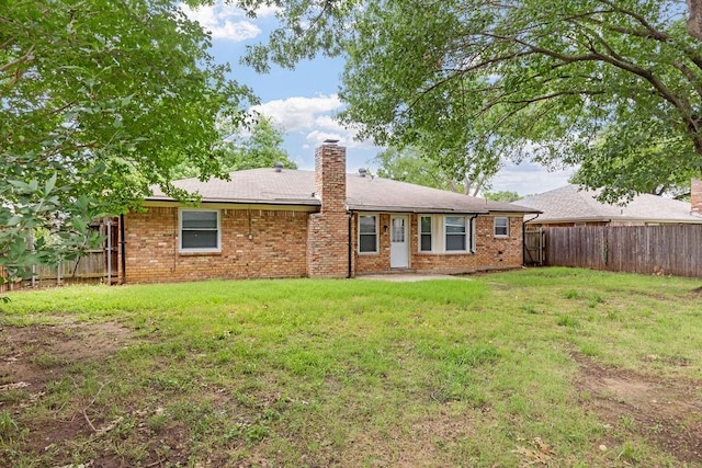 1425 Bryan Dr, Bedford, TX 76022 - rear view of house featuring brick siding and a chimney