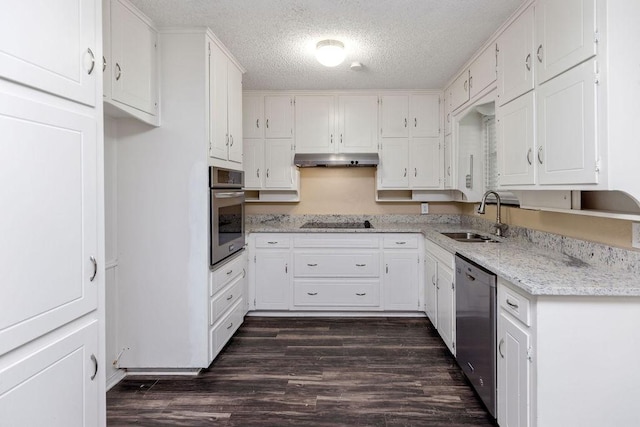 1425 Bryan Dr, Bedford, TX 76022 - kitchen featuring stainless steel appliances, a sink, a textured ceiling, dark wood-style floors, and white cabinetry