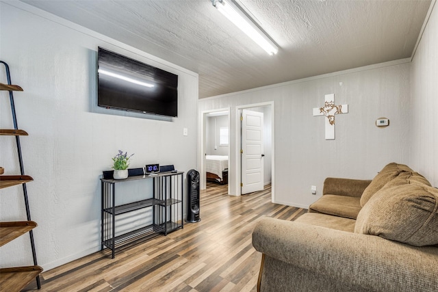 5205 Larue Dr, Caddo Mills, TX 75135 - living area featuring wood finished floors, ornamental molding, and baseboards