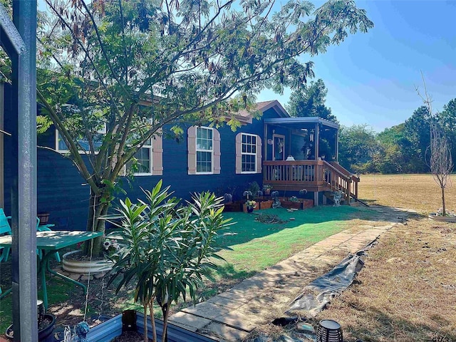 2620 N State Highway 37, Quitman, TX 75783 - view of side of property featuring a lawn and a sunroom