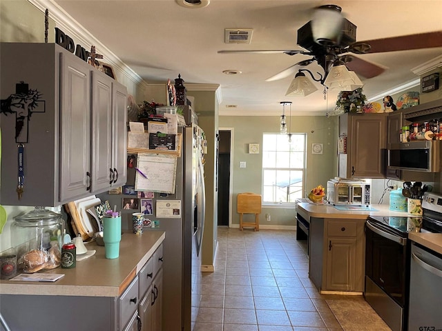 2620 N State Highway 37, Quitman, TX 75783 - kitchen with appliances with stainless steel finishes, crown molding, light countertops, a ceiling fan, and light tile patterned floors