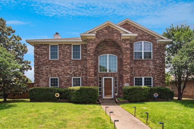 1302 Woodmont Dr, Allen, TX 75002 - traditional-style home featuring brick siding, a front lawn, and a chimney