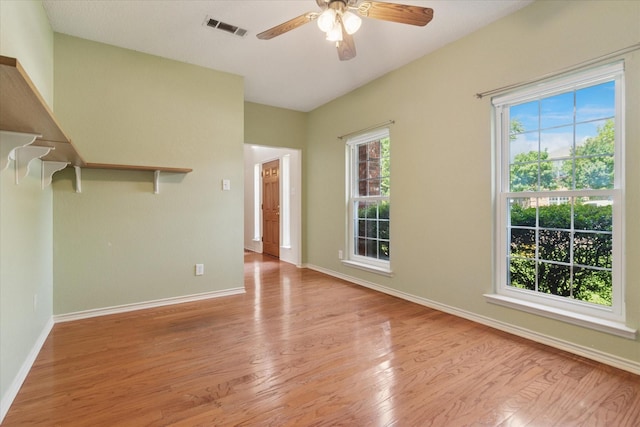1302 Woodmont Dr, Allen, TX 75002 - empty room featuring wood finished floors, a ceiling fan, and baseboards