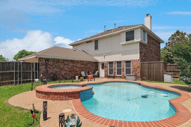 1302 Woodmont Dr, Allen, TX 75002 - view of pool with a fenced backyard, a pool with connected hot tub, and a patio area