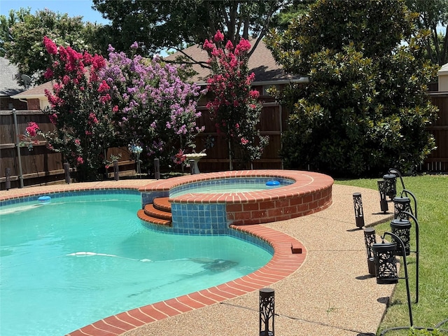 1302 Woodmont Dr, Allen, TX 75002 - view of swimming pool featuring a fenced backyard and a pool with connected hot tub