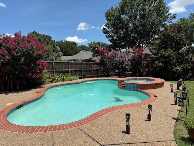 1302 Woodmont Dr, Allen, TX 75002 - view of swimming pool featuring a fenced backyard, a patio, and a pool with connected hot tub