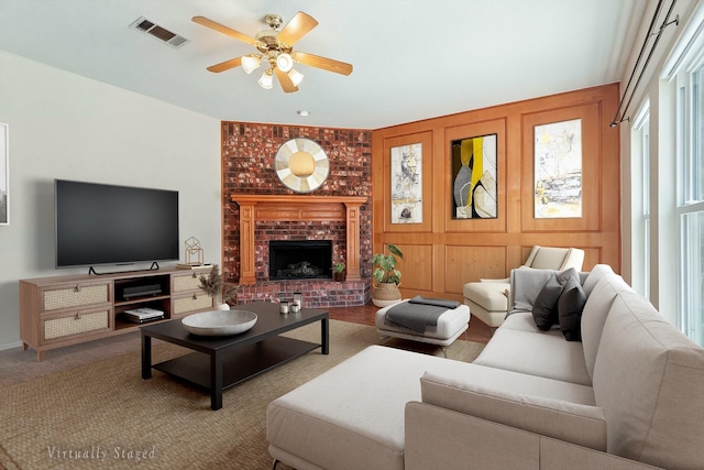 1302 Woodmont Dr, Allen, TX 75002 - living area featuring a ceiling fan and a brick fireplace