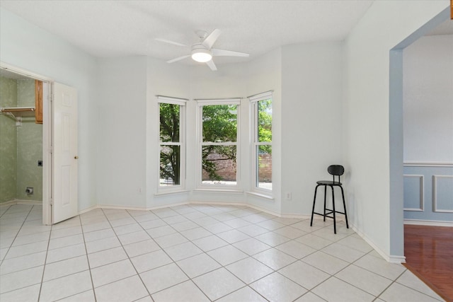1302 Woodmont Dr, Allen, TX 75002 - unfurnished bedroom with light tile patterned floors and ceiling fan