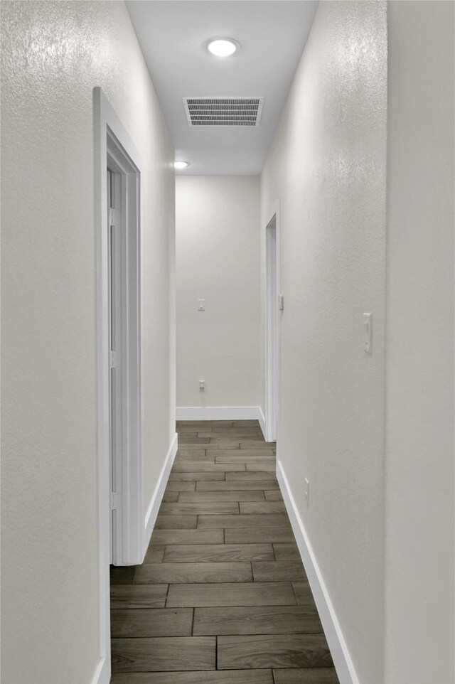 5506 Cold Water Trl, Granbury, TX 76048 - corridor with wood finished floors and baseboards