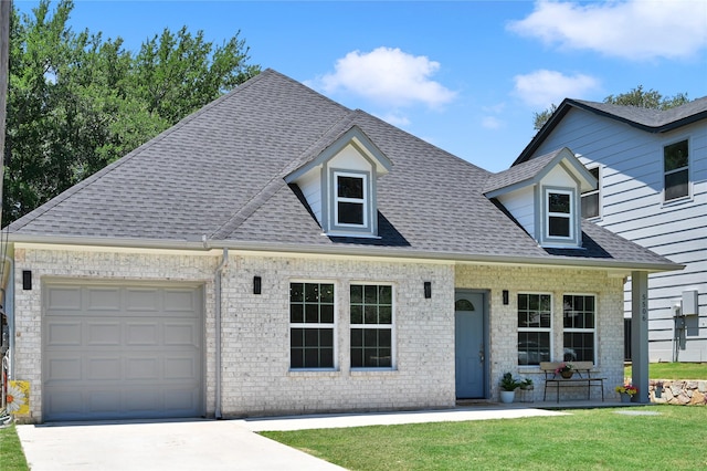 5506 Cold Water Trl, Granbury, TX 76048 - view of front of house with roof with shingles, a front lawn, driveway, an attached garage, and brick siding