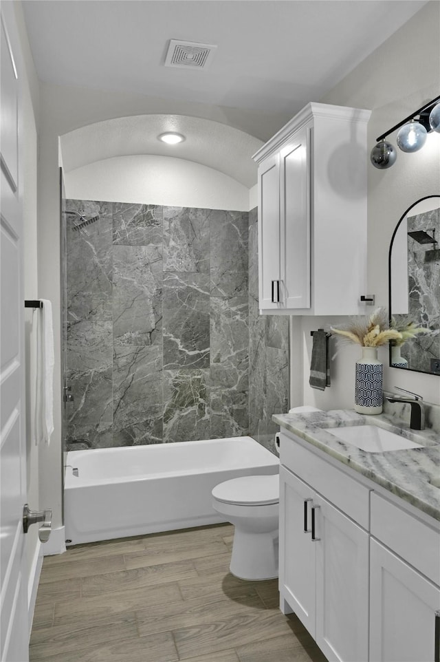 5506 Cold Water Trl, Granbury, TX 76048 - bathroom featuring vanity, shower / bath combination, toilet, and wood finished floors