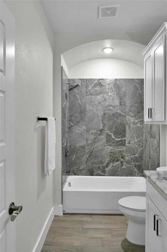 5506 Cold Water Trl, Granbury, TX 76048 - full bathroom with vanity, shower / tub combination, toilet, wood finished floors, and baseboards