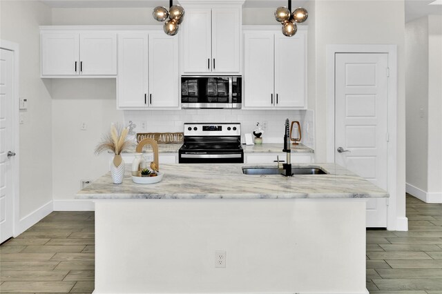 5506 Cold Water Trl, Granbury, TX 76048 - kitchen featuring stainless steel range with electric stovetop, a sink, wood finished floors, and white cabinets