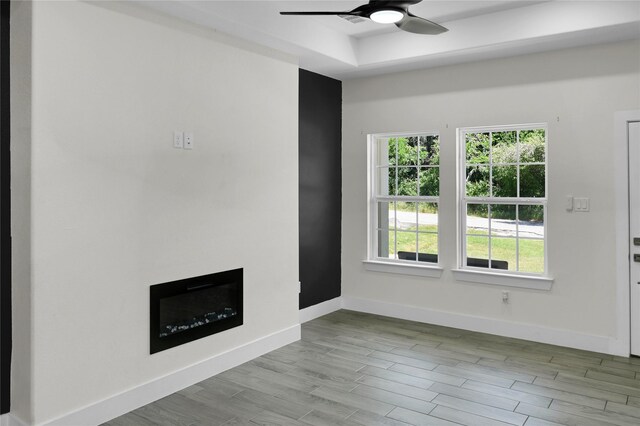 5506 Cold Water Trl, Granbury, TX 76048 - unfurnished living room with plenty of natural light, a ceiling fan, baseboards, and a fireplace