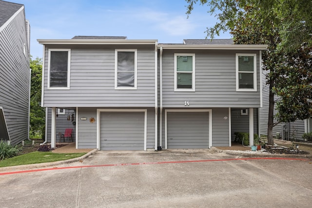 9222 Church Rd Unit 108, Dallas, TX 75231 - view of property with a garage and driveway