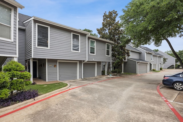 9222 Church Rd Unit 108, Dallas, TX 75231 - multi unit property featuring an attached garage and asphalt driveway
