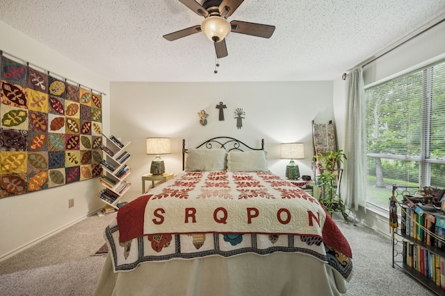 9222 Church Rd Unit 108, Dallas, TX 75231 - bedroom with carpet floors, multiple windows, a textured ceiling, and a ceiling fan