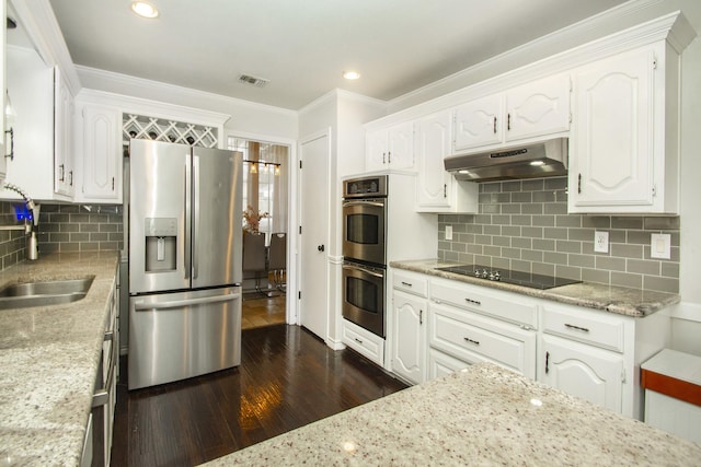 611 Christan Ct, Rockwall, TX 75087 - kitchen featuring stainless steel appliances, under cabinet range hood, a sink, dark wood-style flooring, and white cabinets