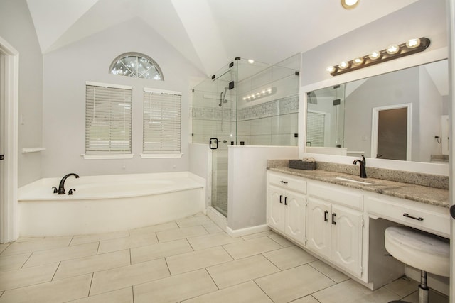 611 Christan Ct, Rockwall, TX 75087 - full bath with a garden tub, vaulted ceiling, a shower stall, vanity, and tile patterned flooring