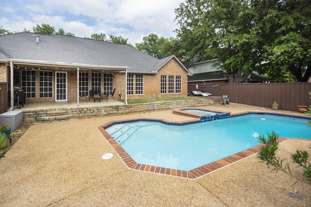 611 Christan Ct, Rockwall, TX 75087 - view of swimming pool featuring a patio area, a fenced backyard, and a pool with connected hot tub