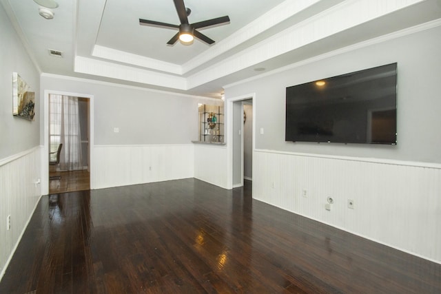 611 Christan Ct, Rockwall, TX 75087 - unfurnished living room with a wainscoted wall, a ceiling fan, wood-type flooring, a tray ceiling, and ornamental molding