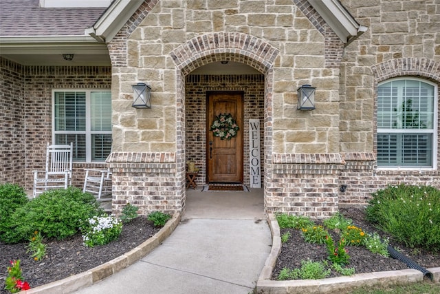 9410 Tay Ln, Justin, TX 76247 - doorway to property with brick siding, stone siding, and roof with shingles