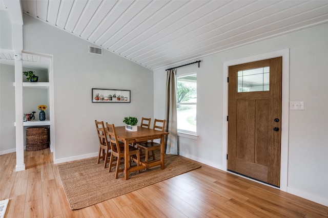 1410 Traildust Dr, Lowry Crossing, TX 75069 - dining room with light wood-style flooring, lofted ceiling, and baseboards