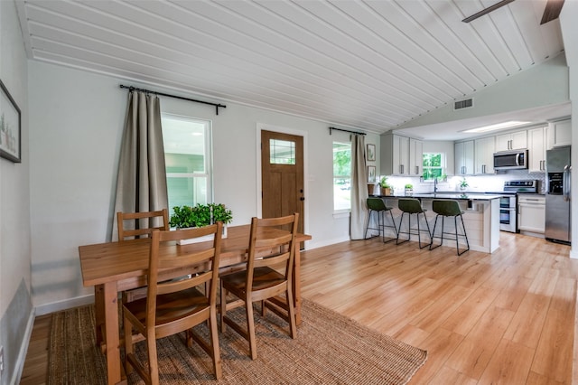 1410 Traildust Dr, Lowry Crossing, TX 75069 - dining area with light wood-style floors and lofted ceiling
