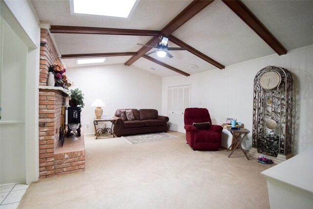 738 Westwood Dr, Marlin, TX 76661 - living room featuring a ceiling fan, a textured ceiling, carpet flooring, and a brick fireplace
