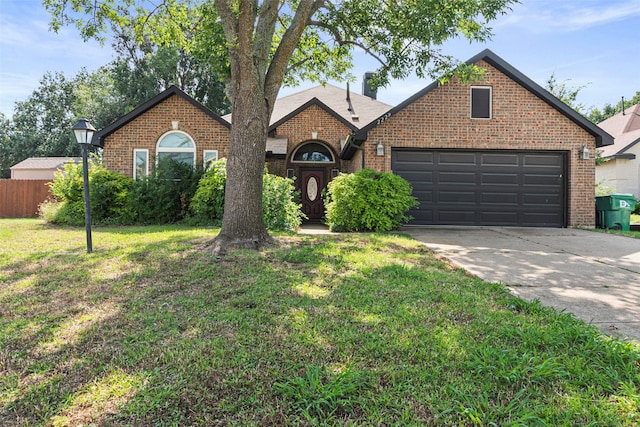 2229 Brooklake St W, Denton, TX 76207 - view of front facade with brick siding, concrete driveway, and an attached garage