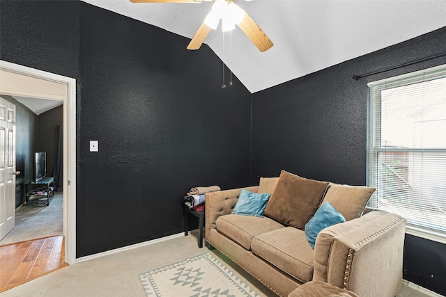 2229 Brooklake St W, Denton, TX 76207 - living area featuring a textured wall, a ceiling fan, lofted ceiling, light wood-type flooring, and baseboards