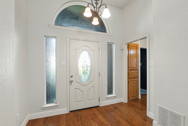 2229 Brooklake St W, Denton, TX 76207 - entrance foyer with a chandelier, wood finished floors, and baseboards