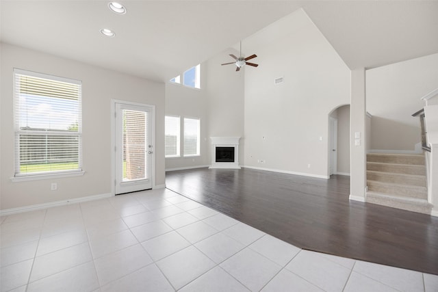 4104 Portola Dr, Mckinney, TX 75070 - unfurnished living room featuring ceiling fan, healthy amount of natural light, recessed lighting, tile patterned floors, and stairway