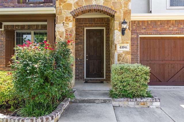 4104 Portola Dr, Mckinney, TX 75070 - doorway to property featuring stone siding and brick siding
