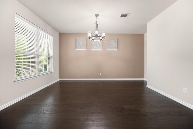 4104 Portola Dr, Mckinney, TX 75070 - empty room featuring a chandelier and dark wood finished floors