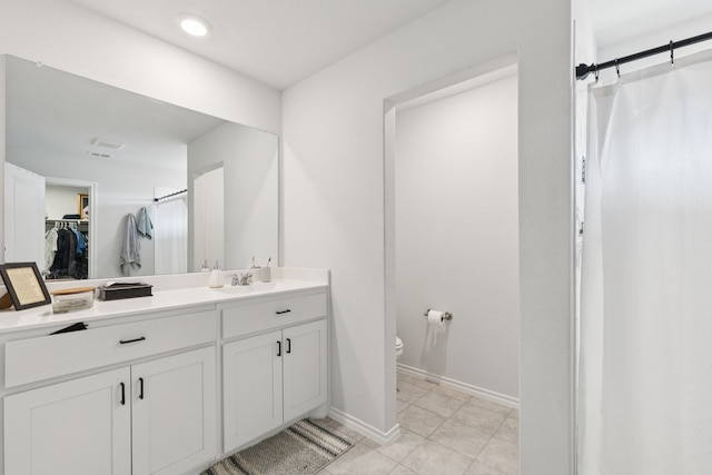 140 Running River Dr, Boyd, TX 76023 - bathroom with vanity, a spacious closet, a shower stall, and tile patterned floors