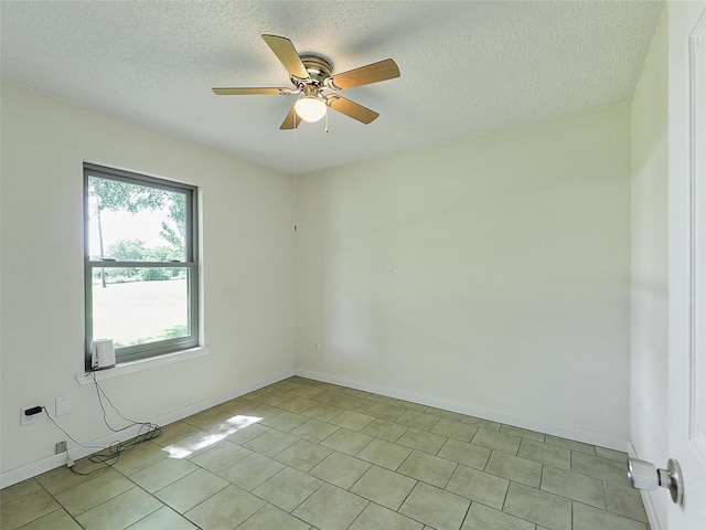 7275 Fm 455 W, Sanger, TX 76266 - unfurnished room with a ceiling fan, light tile patterned floors, a textured ceiling, and baseboards