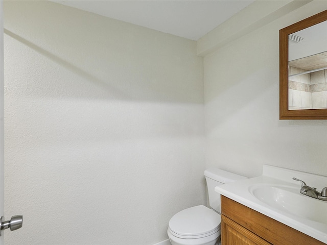 7275 Fm 455 W, Sanger, TX 76266 - bathroom featuring toilet, vanity, and baseboards