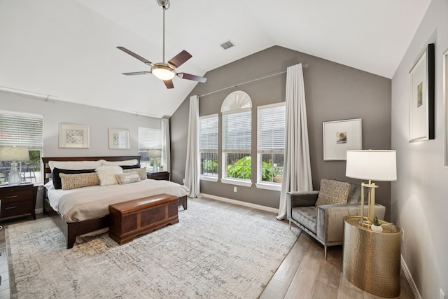945 Brentwood Dr, Murphy, TX 75094 - bedroom featuring light wood finished floors, vaulted ceiling, a ceiling fan, and baseboards