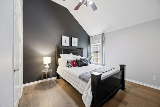 945 Brentwood Dr, Murphy, TX 75094 - bedroom featuring wood finished floors, baseboards, high vaulted ceiling, and ceiling fan