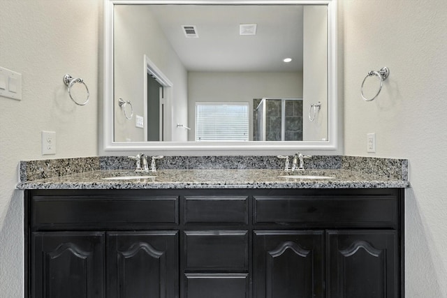 3112 Stonecrop Trl, Denton, TX 76226 - bathroom featuring double vanity and tiled shower
