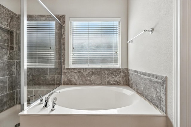 3112 Stonecrop Trl, Denton, TX 76226 - bathroom with a bath and tiled shower