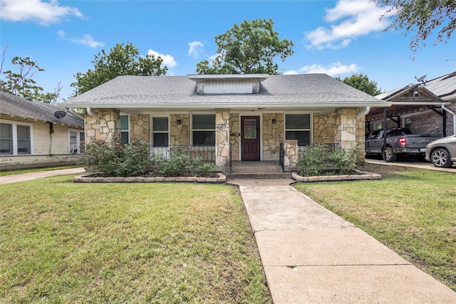 729 S Winnetka Ave, Dallas, TX 75208 - bungalow-style house featuring stone siding, covered porch, and a front lawn