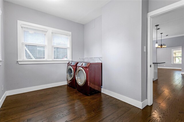 729 S Winnetka Ave, Dallas, TX 75208 - laundry room with washing machine and dryer, dark wood-style flooring, baseboards, and a chandelier