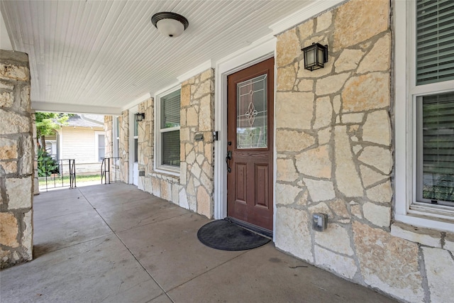 729 S Winnetka Ave, Dallas, TX 75208 - doorway to property with stone siding and covered porch