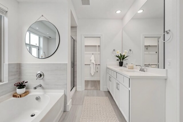 1721 Horseshoe Ln, Van Alstyne, TX 75495 - full bath featuring double vanity, a shower stall, recessed lighting, baseboards, and tile patterned floors