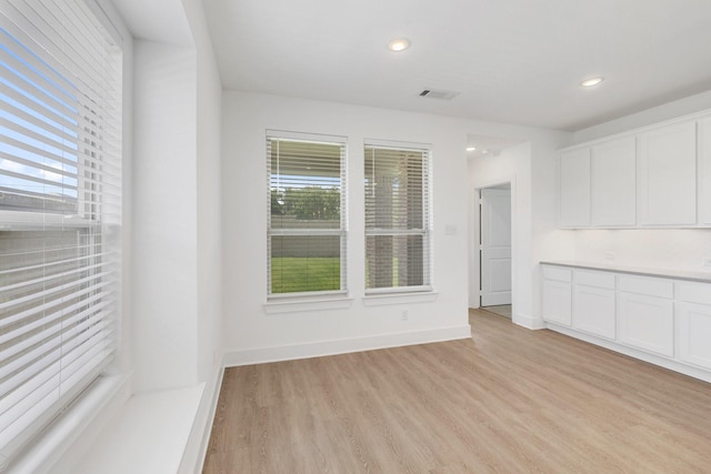 1721 Horseshoe Ln, Van Alstyne, TX 75495 - empty room with light wood-type flooring, recessed lighting, and baseboards