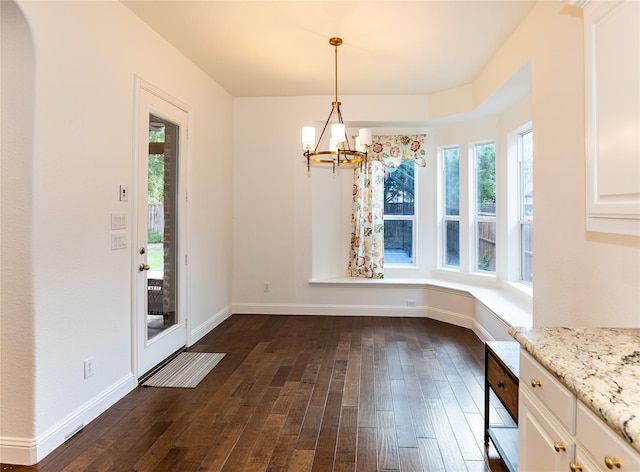 6925 Mercy Rd, Frisco, TX 75035 - unfurnished dining area with a chandelier, dark wood-style floors, and plenty of natural light