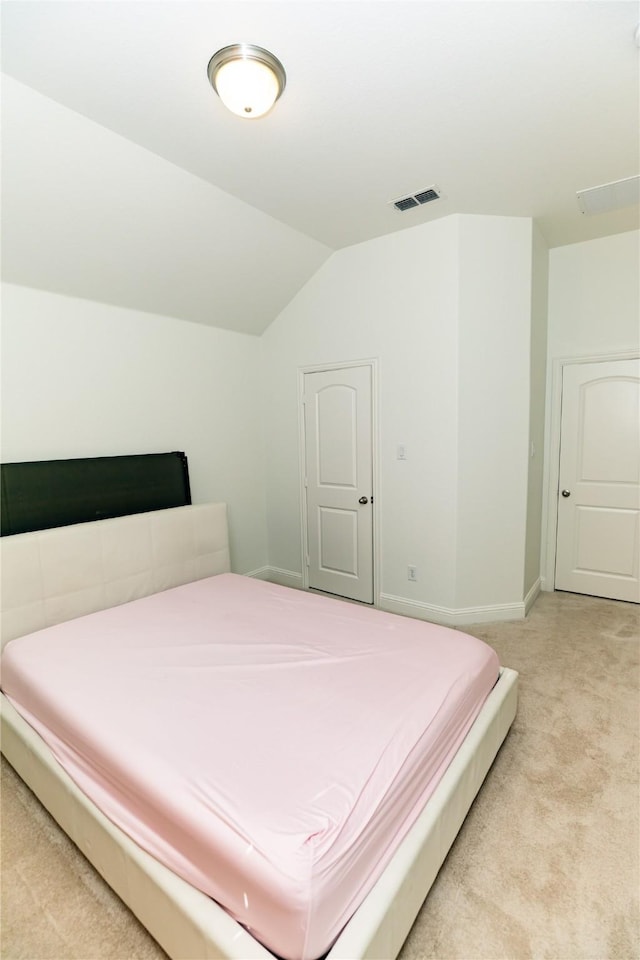 6925 Mercy Rd, Frisco, TX 75035 - bedroom featuring light colored carpet, vaulted ceiling, and baseboards